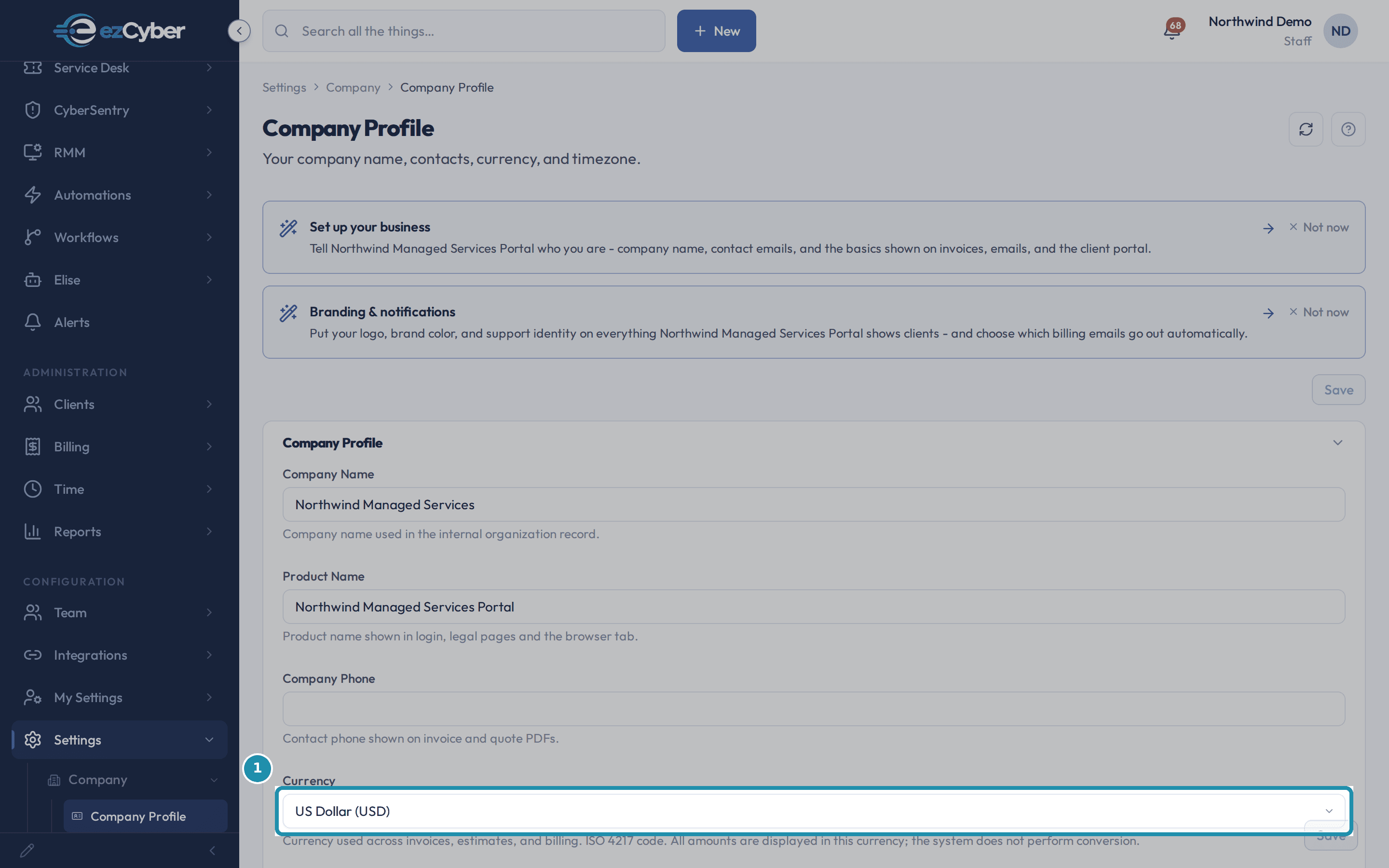 The Company Profile page's Currency field, set to US Dollar (USD), boxed, with its description below reading that all amounts display in this currency and the system does not perform conversion.